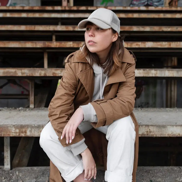 Woman in casual attire exploring different styles of caps for women