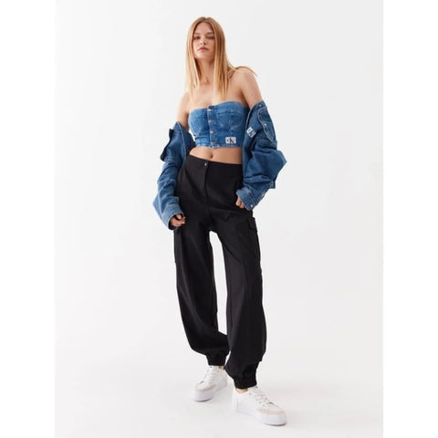 Calvin Klein model sporting denim jacket with black jeans