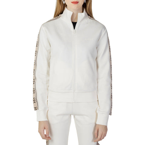 Woman in Guess Active white jacket, urban city style