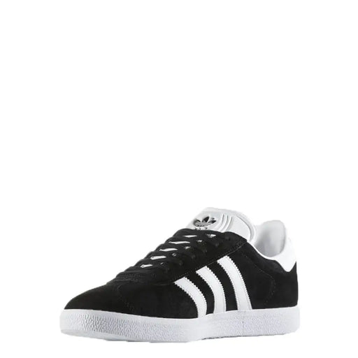 Black and white adidas gazelle sneakers with suede upper.