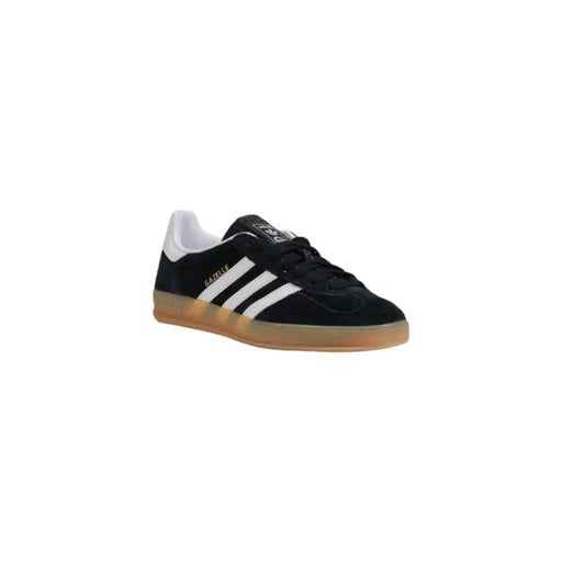 Black and white adidas samba indoor soccer shoe with gum sole.