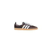 Brown leather adidas samba sneaker with white stripes and gum sole.