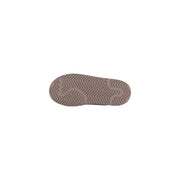 The sole of beigew rubber Adidas Originals women leather platform slippers with a wavy zigzag tread pattern