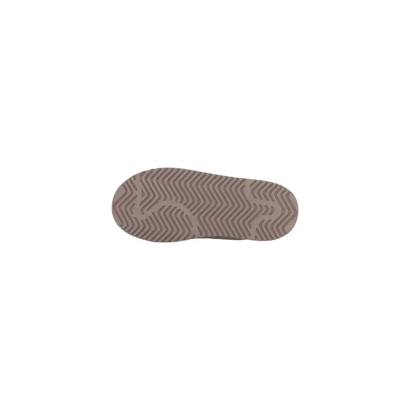 The sole of beigew rubber Adidas Originals women leather platform slippers with a wavy zigzag tread pattern