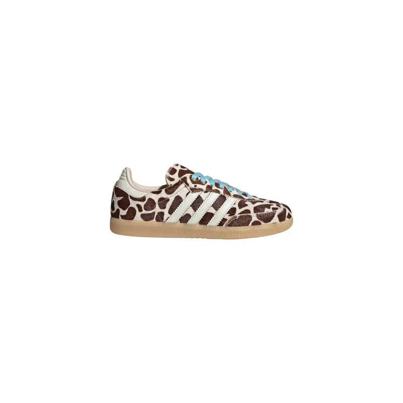 Adidas Originals women brown leopard leather sneakers featuring brown and cream giraffe print with light blue laces