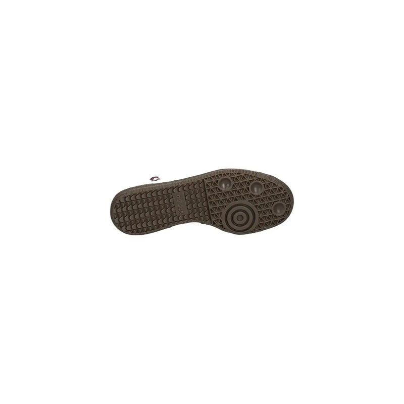 Brown rubber sole with textured tread and circular grip design on adidas originals women leather sneakers bordeaux