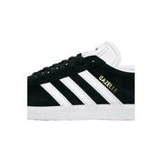 Adidas women black suede Gazelle sneaker with white three stripes gold lettering polyurethane lace up design