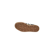 Adidas women black suede slip on sneakers with white stripes and tan rubber sole in black and white design