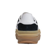 Adidas women black suede slip on sneaker with white accents and a chunky tan rubber sole