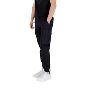 Men’s black cotton blend cargo trousers with elastic cuffs and white sneakers