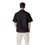 Men’s black short-sleeve V-neck shirt with pockets paired with light beige cargo pants