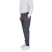Man wearing Antony Morato Grey Zip Button Fall Winter Men Trousers with white sneakers