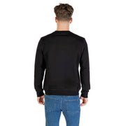 Men’s plain black crew-neck sweatshirt paired with blue jeans from Antony Morato Fall Winter collection