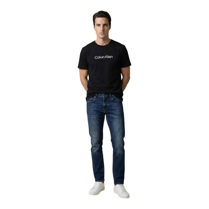 Black Calvin Klein cotton t-shirt with white logo paired with Antony Morato men Ozzy tapered fit blue cotton jeans