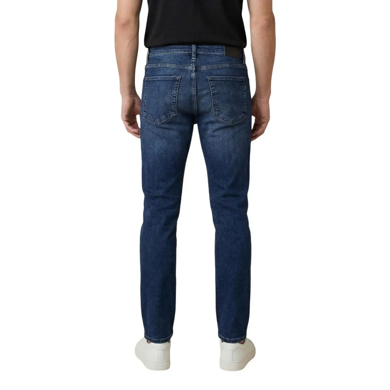 Dark blue cotton antony morato men ozzy tapered fit jeans shown from the back with slim fit and classic pockets