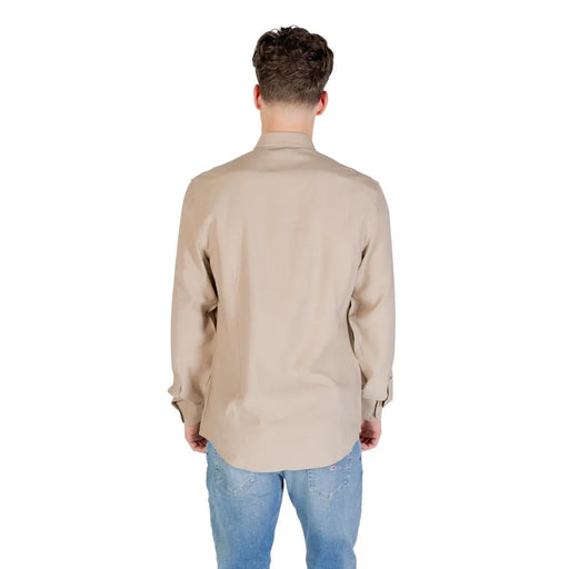 Beige long-sleeved Antony Morato men shirt with classic collar and buttoned cuffs made from soft material
