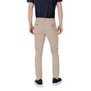 Beige slim fit chino trousers with black buttoned back pockets shown from the back by antony morato men trousers