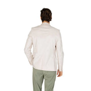 A man wearing an antony morato men white cotton modal blazer with a cream-colored tailored classic fit and subtle stitching details