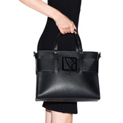 Armani Exchange black faux leather tote bag with shoulder strap and prominent rectangular logo plaque on the front