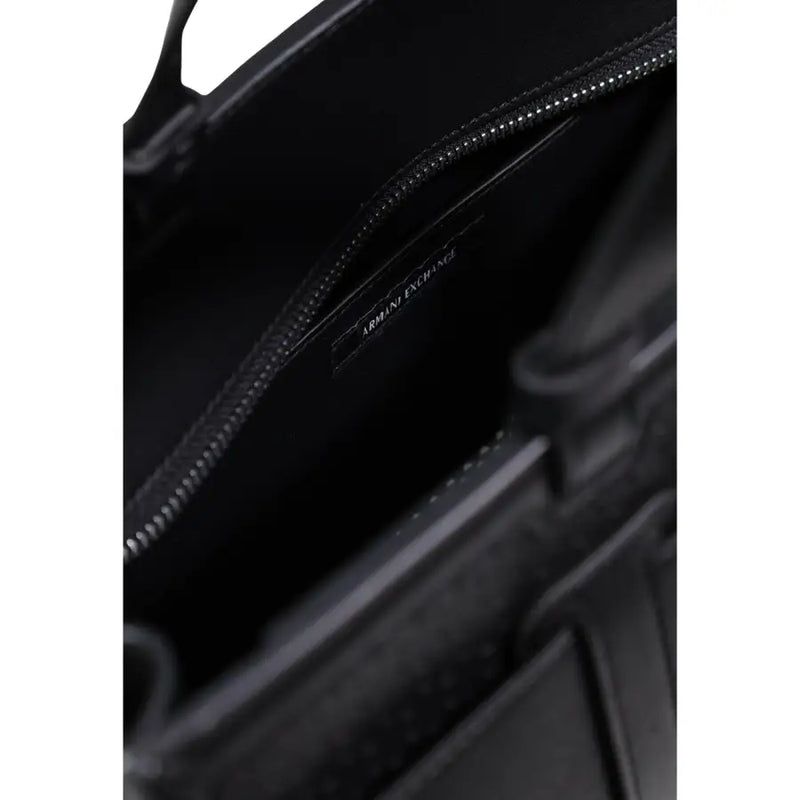 Black leather Armani Exchange handbag interior with zip pocket and brand label in polyurethane material