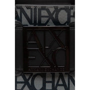 Black square metal plaque with embossed ax logo and armani exchange text on black print polyurethane handbag