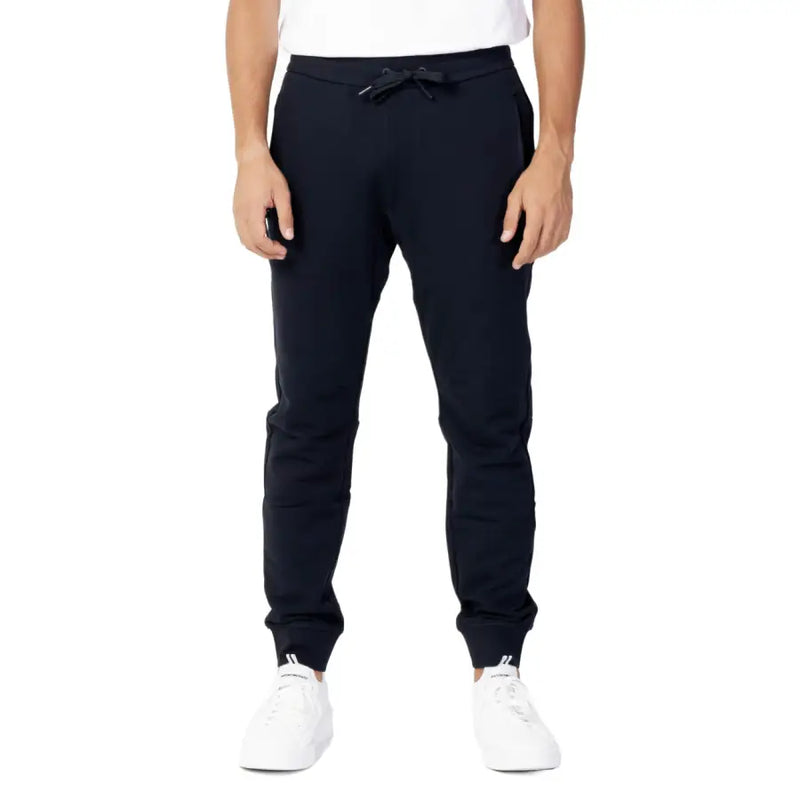 Men’s navy blue cotton sweatpants with drawstring waist and ribbed cuffs for Fall Winter Armani Exchange collection