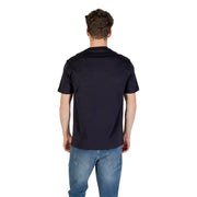 Men’s navy blue short-sleeve cotton T-shirt paired with blue jeans from Armani Exchange