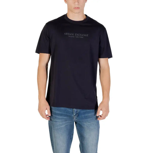 Men’s navy blue crew neck cotton T shirt paired with light wash jeans from Armani Exchange
