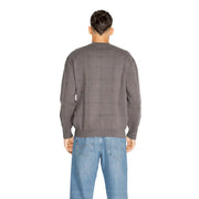 Charcoal gray quilted sweater with a checkered pattern and ribbed cuffs, collar, and hem.