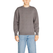 Charcoal gray sweater with geometric pattern and ribbed cuffs, collar, and hem.
