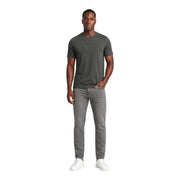 Armani exchange Graue Slim-Fit-Jeans für Herren, getragen vom Model mit einem dunkelolivgrünen Rundhalsausschnitt t-shirt Vorderansicht