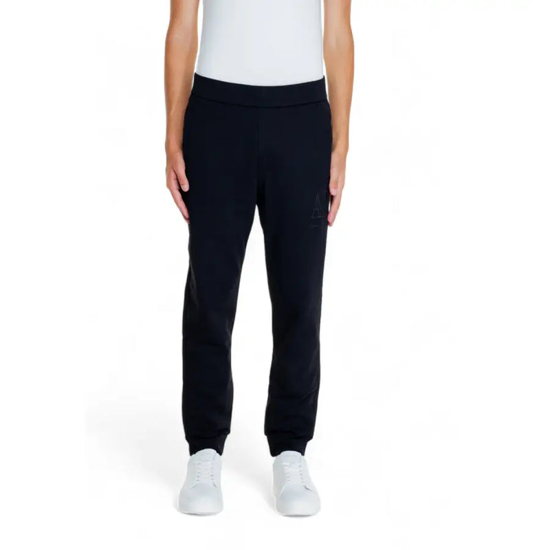 Model wearing black cotton joggers and a white tank top for Armani Exchange Men trousers