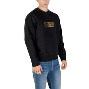 Men’s black crewneck sweatshirt with gold rectangular logo from Armani Exchange