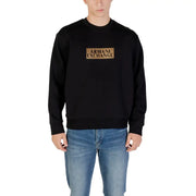 Men’s black crewneck sweatshirt with gold Armani Exchange logo on the chest