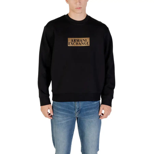 Men’s black crewneck sweatshirt with gold Armani Exchange logo on the chest
