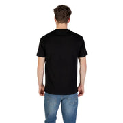 Men’s black short-sleeve round neck cotton T-shirt paired with blue jeans from Armani Exchange