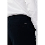 Back side of black textured Armani Exchange men cotton trousers with subtle pinstripe and brand label on pocket