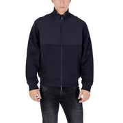 Armani Exchange Herrenblazer in Blau mit langer Fronttasche, zweifarbigen marineblauen Einsätzen und Reißverschluss-Trainingsjacken-Design