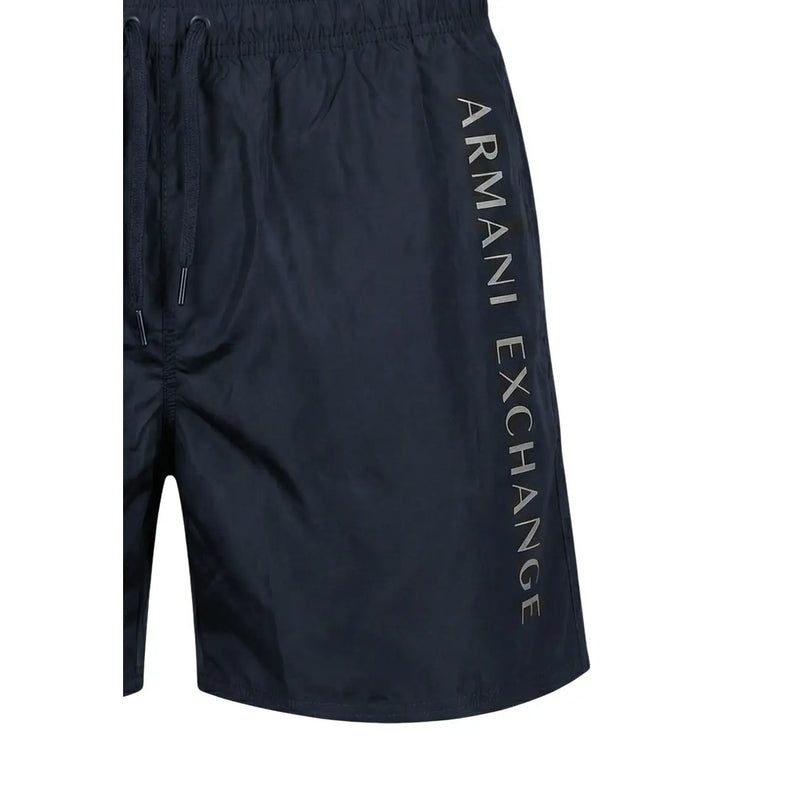 Dark navy blue armani exchange men swim trunks with vertical logo side print made of polyester for swimwear use