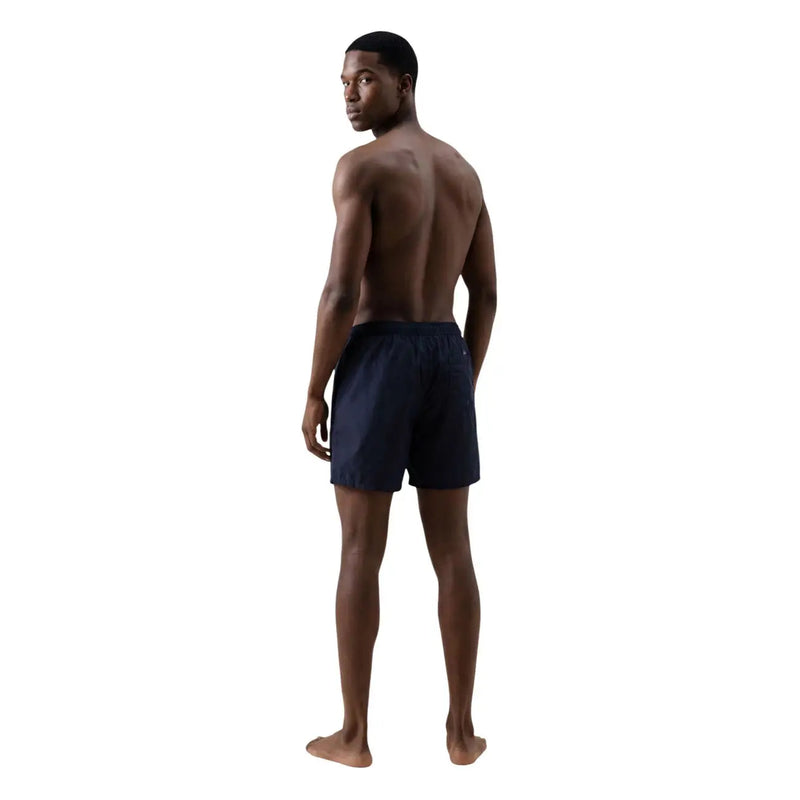 Armani Exchange men blue print polyester swimwear shorts in navy blue with a sleek design and elastic waistband