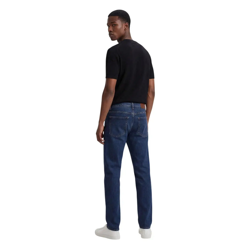Dark blue denim jeans with classic five pocket design and subtle thigh fading in armani exchange men t shirt product image