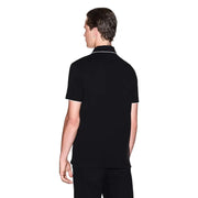Armani Exchange Schwarzes Herren-Polohemd aus Baumwolle mit kurzen Ärmeln und weißem Besatz an Kragen und Ärmelbündchen.