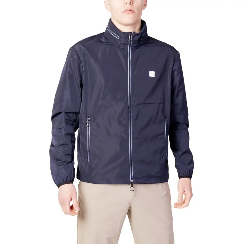 Men’s navy blue windbreaker jacket with white trim and small chest logo from Armani Exchange