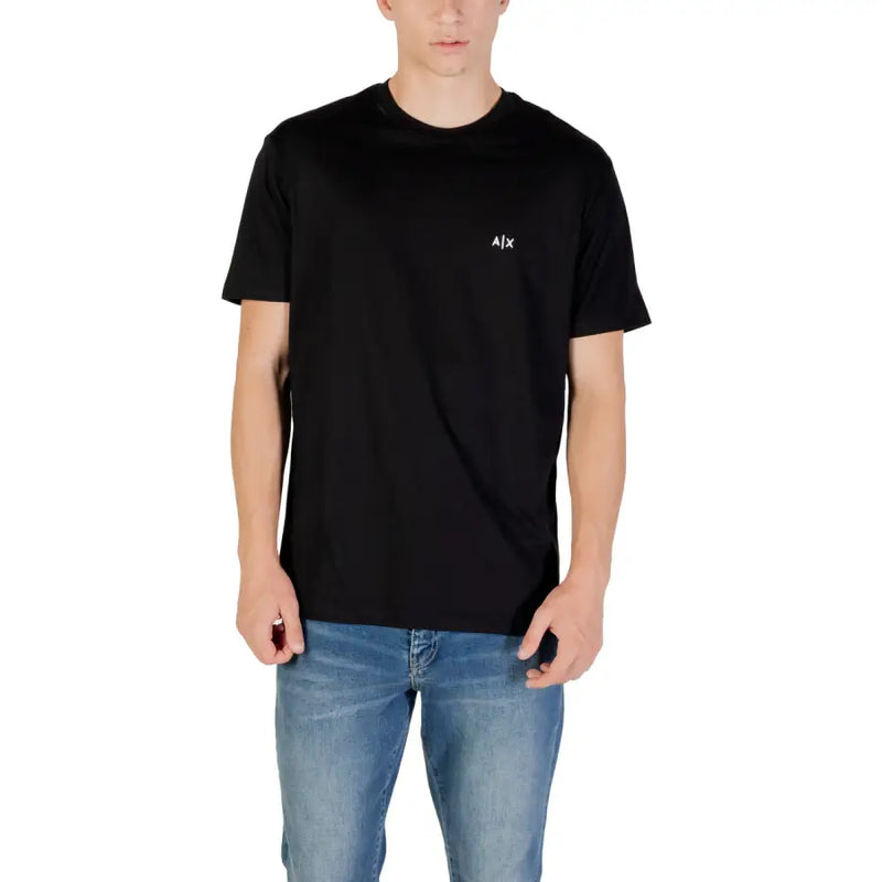 Men’s black short-sleeved T-shirt paired with light blue jeans, stylish casual outfit