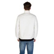 Men’s white Armani Exchange long fall winter sweatshirt with black undershirt and blue jeans