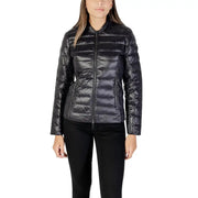 Woman wearing Armani Exchange black quilted puffer jacket with front zipper closure