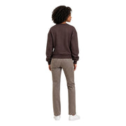 A woman wears an Armani Exchange women brown sweatshirt in viscose blend paired with gray straight-leg jeans