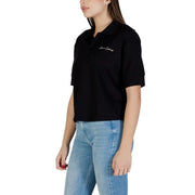 Armani Exchange Schwarzes, kurzärmeliges Poloshirt aus Baumwolle für Damen mit dezentem, gesticktem Logo auf der Brust