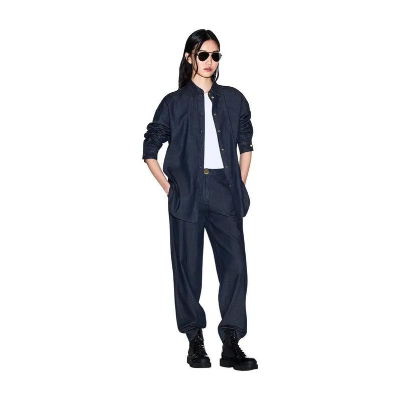 Navy blue oversized cotton button-down shirt with rolled sleeves and subtle collar detail for women