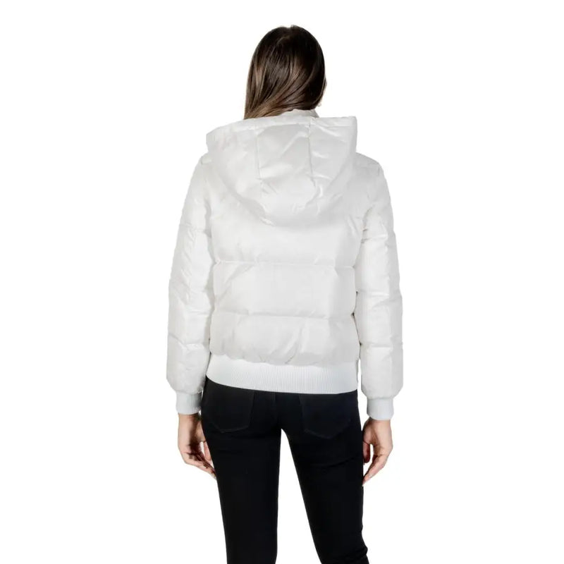 Woman wearing Armani Exchange long white hooded fall winter puffer jacket and black pants